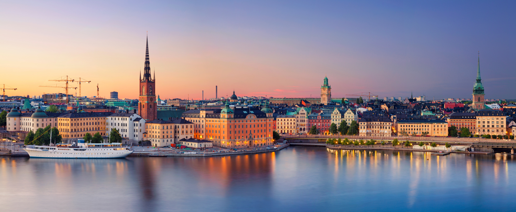 It is a picture of Stockholm, Old town, seen from the water.